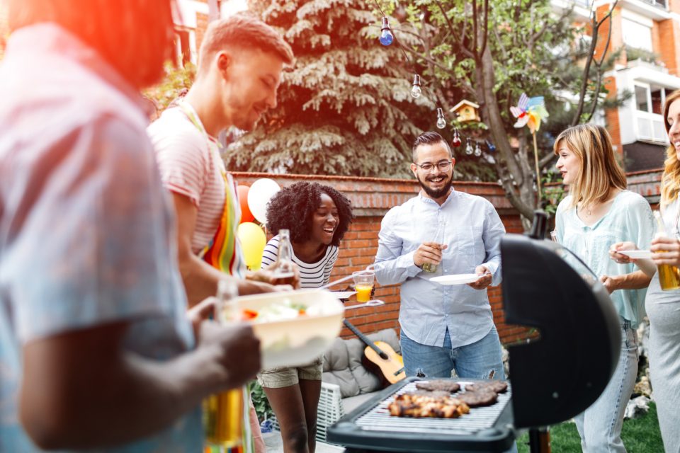 Friends hanging out at barbecue party.