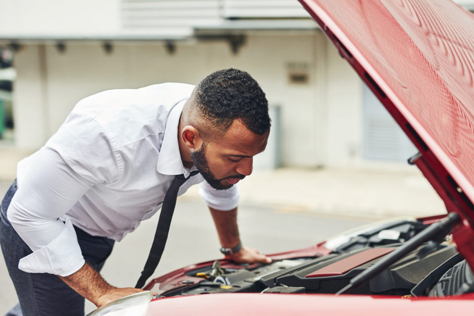 A man repairs his new car