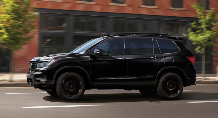 Black Honda SUV on the street.